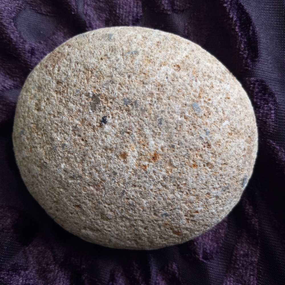 Mano grinding rock. Most likely Native American.